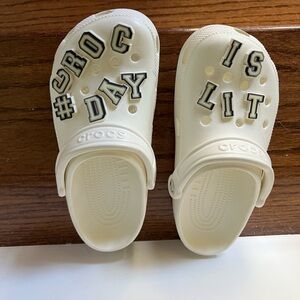 While CROCS  with Fun Lettering Sz M5/W7